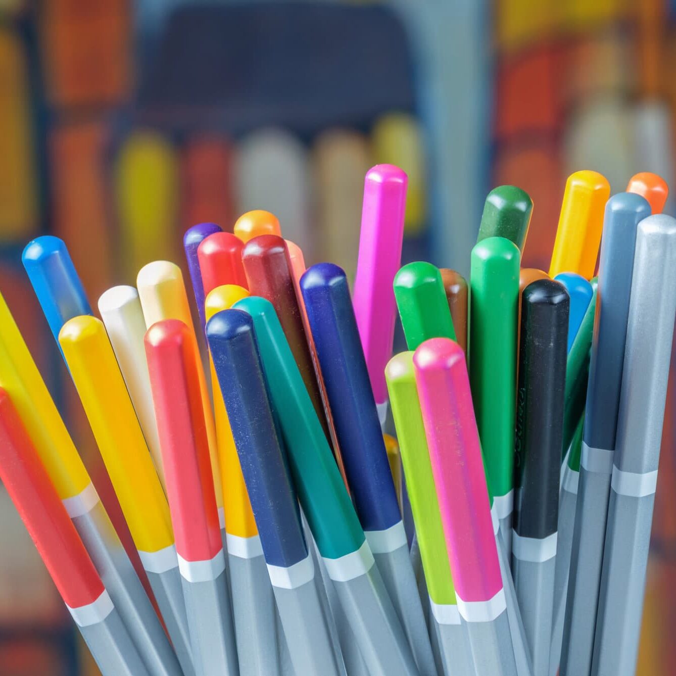 Set of color drawing pencils with colorful background